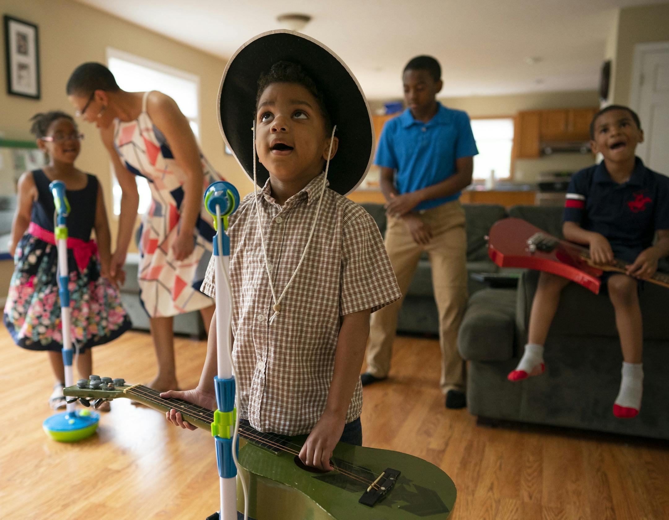 Daniel Brundidge, 4, sang along to the "Old Town Road" video with his mom, Sheletta, and siblings, Cameron, 5, Andrew, 12, and Brandon, 6, from left, Sunday evening at their home in Cottage Grove.