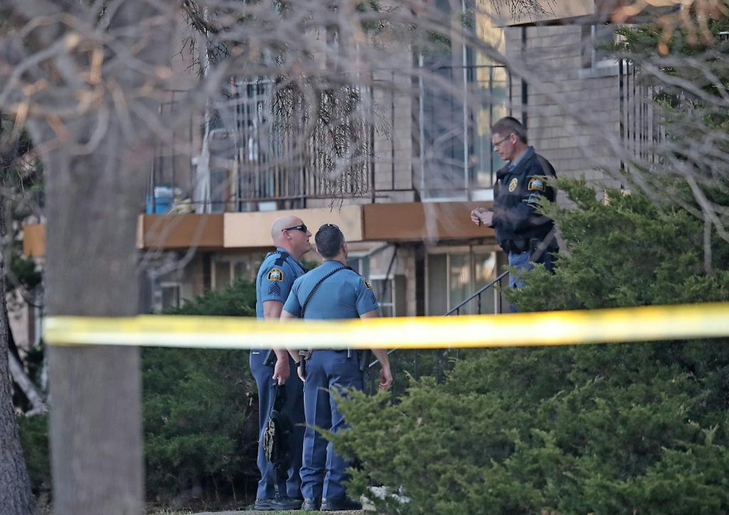 St. Paul police investigate the scene of a shooting Friday at an apartment complex on the 1600 block of English Street in St. Paul.