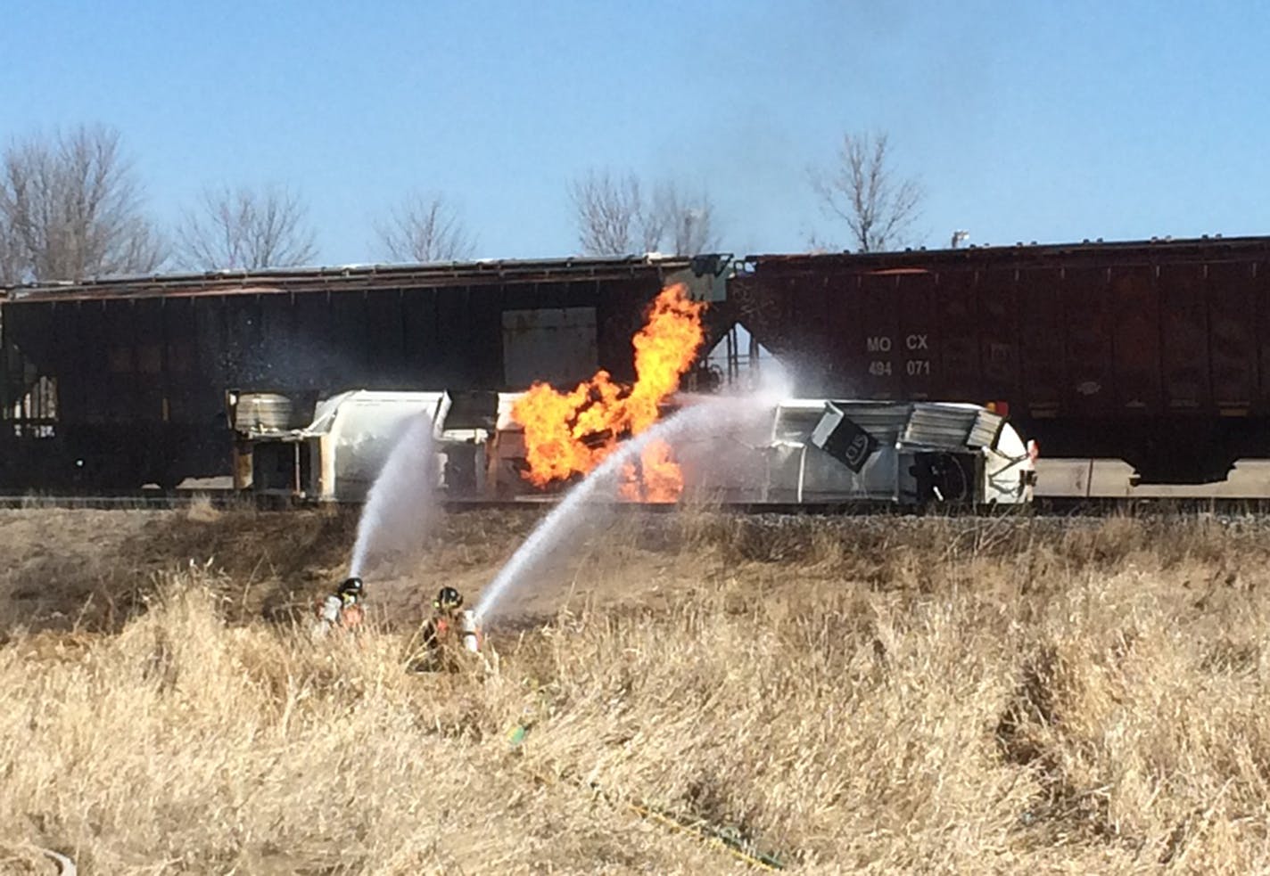 A northbound Canadian Pacific train collided with a propane tanker truck in northwestern Minnesota on Thursday, igniting a fire and prompting the evacuation of Callaway, Minn.