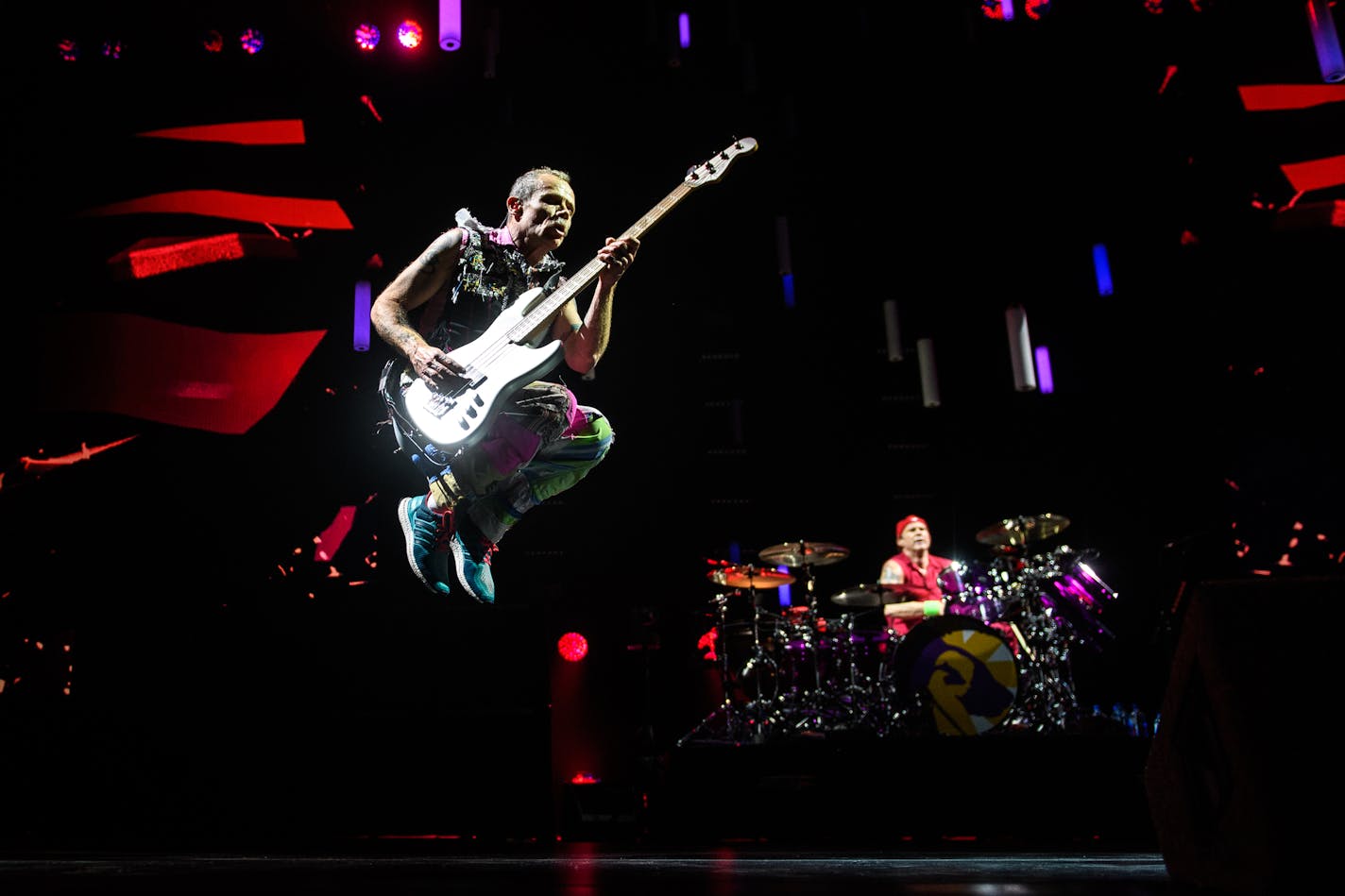 Red Hot Chili Peppers bassist, Flea, jumped in the air during the band's performance Saturday night. ] (AARON LAVINSKY/STAR TRIBUNE) aaron.lavinsky@startribune.com The Red Hot Chili Peppers performed on Saturday, Jan. 21, 2017 at Target Center in Minneapolis, Minn.