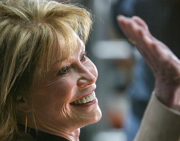 Mary Tyler Moore waved to the cheering crowd in 2002 before the unveiling of the statue at 7th and Nicollet Mall. Moore, who was 80, died Wednesday.