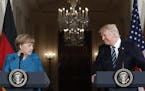 President Donald Trump and German Chancellor Angela Merkel participate in a joint news conference Friday at the White House.