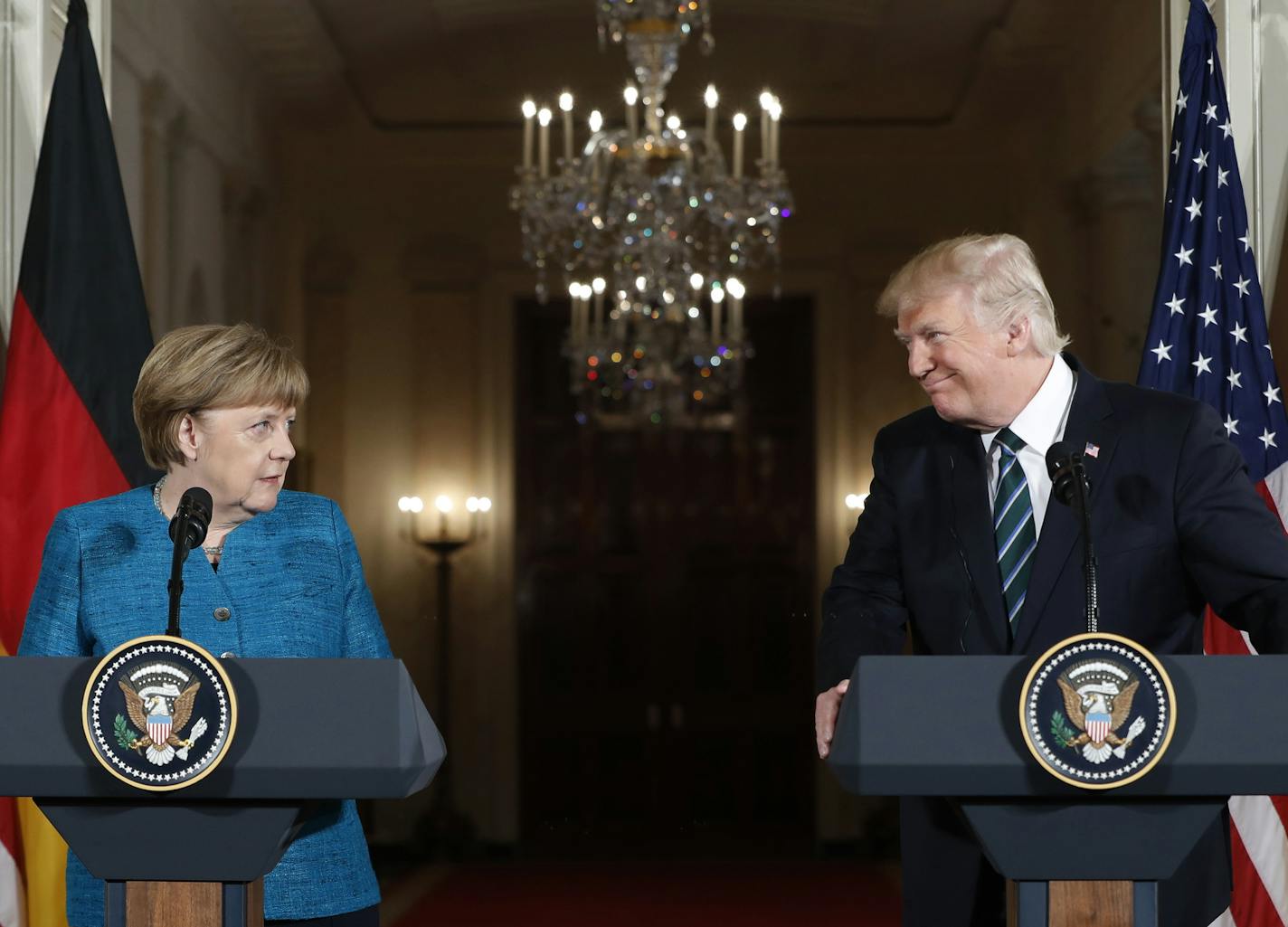 President Donald Trump and German Chancellor Angela Merkel participate in a joint news conference Friday at the White House.