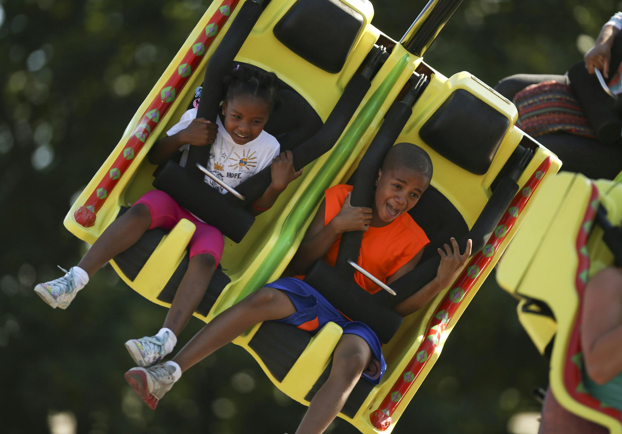 The Minnesota State Fair opened Thursday, August 22, 2013 on a perfect day, weather-wise. Janece Duputie, 6, and her brother Samuel, 12, of Golden Valley had a wild ride on the Viper Thursday afternoon during their family's visit to the fair. ] JEFF WHEELER ‚Ä¢ jeff.wheeler@startribune.com ORG XMIT: MIN1308221816475780