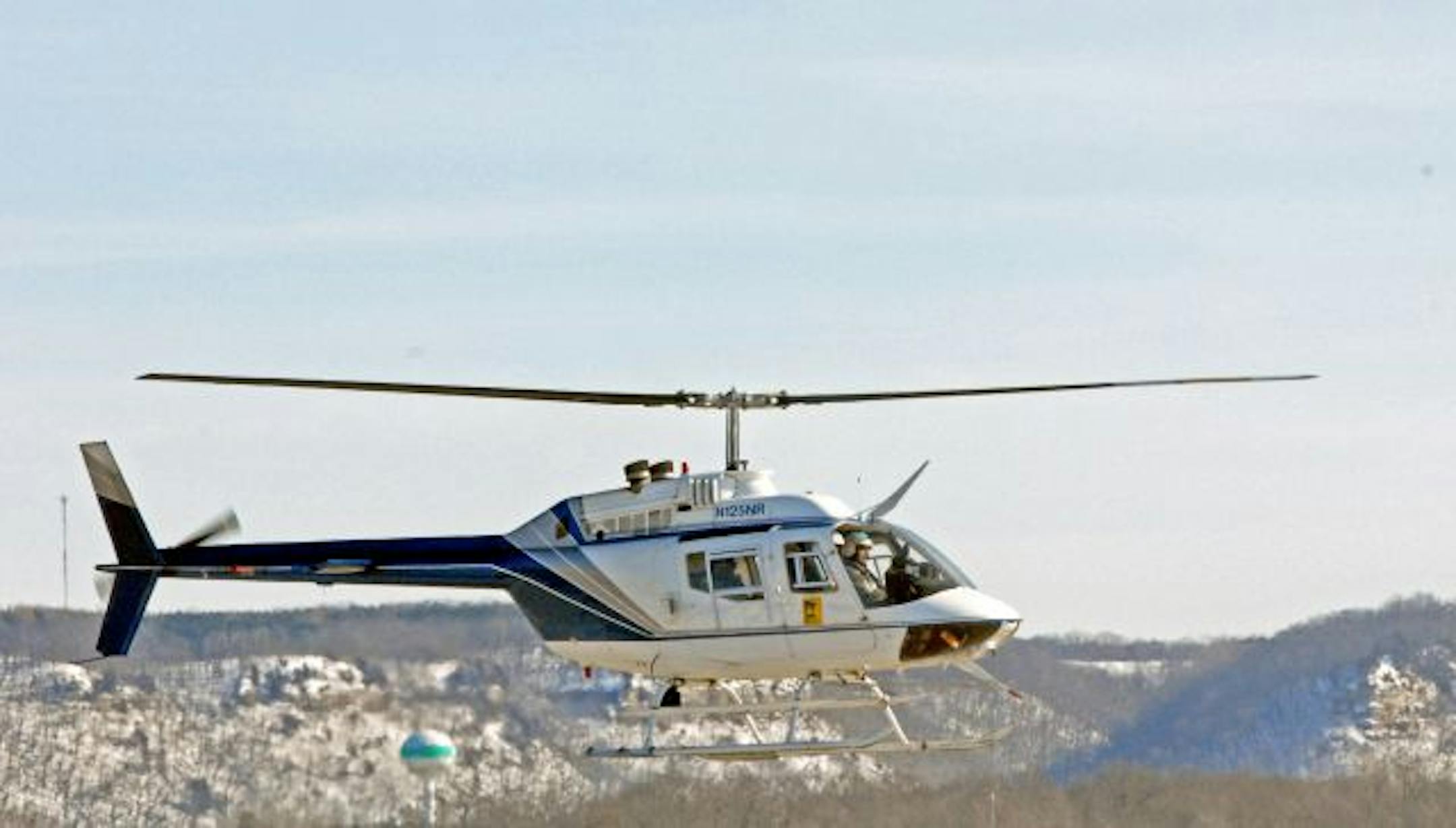 A DNR helicopter stationed in Brainerd was repositioned to southeast Minnesota last week to survey deer in a special zone near the town of Pine Island, where a wild deer shot by an archer Nov. 28 was found to be infected with chronic wasting disease. DNR conservation officer pilot Brad Maas flew the helicopter, while Dave Pauly, an area wildlife supervisor from the Mille Lacs area, and Brian Haroldson, a deer researcher from Madelia, counted deer. The chopper refueled at the Red Wing, Minn., air