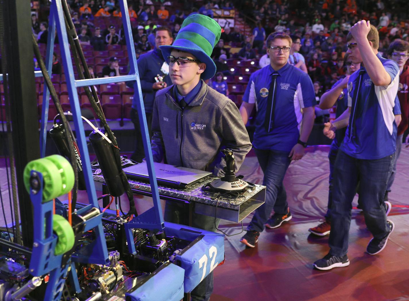 Greenbush-Middle River robotics team members Amy Stauffenecker (photographer left), Max Utter, Ryan Hlucny, Kyle Stauffenecker&#xa0; roll their robot into place before competition in a regional robotics tournament at U of M. BRIAN PETERSON &#x2022; brian.peterson@startribune.com
Minneapolis, MN 03/30/18