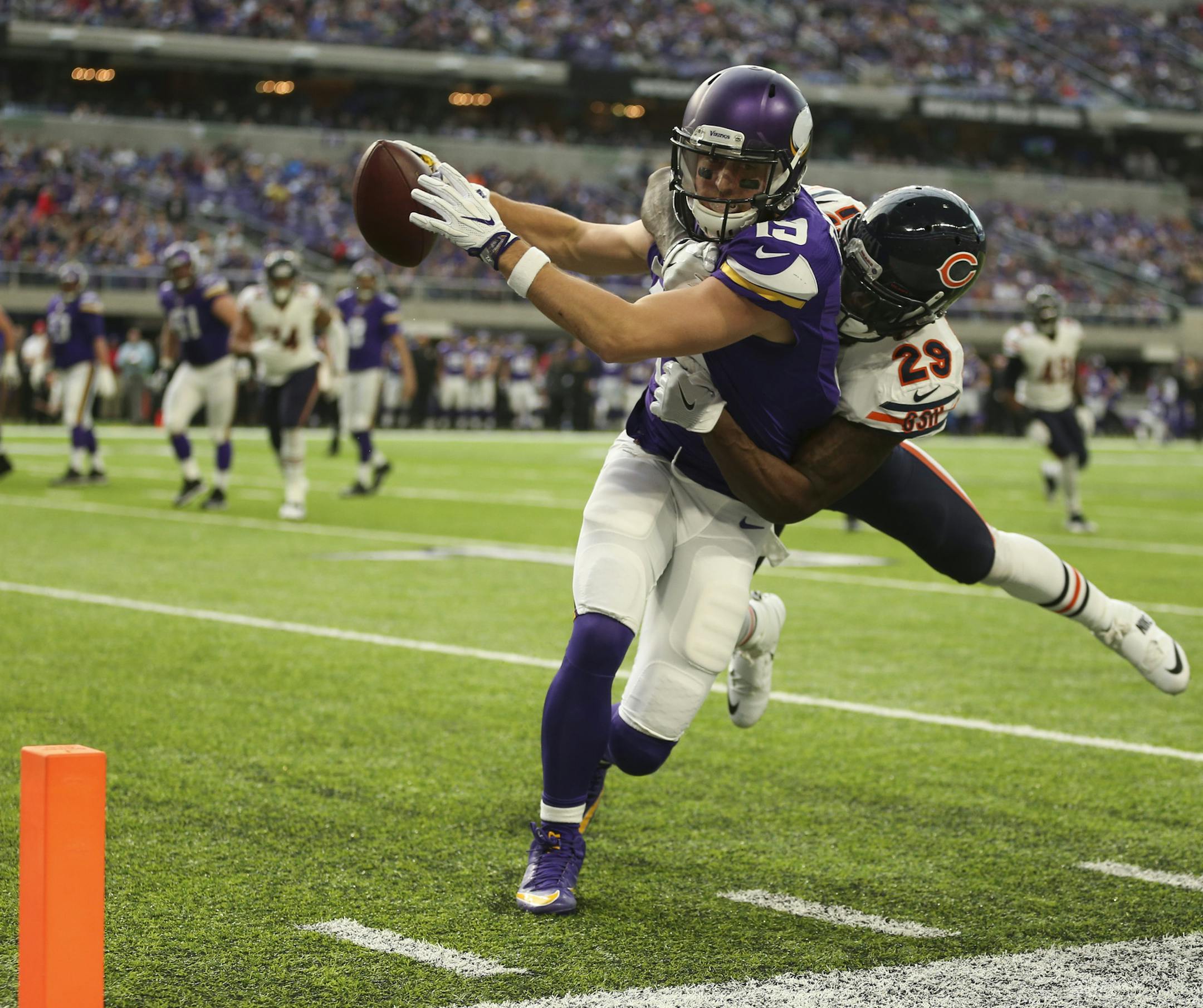 Vikings wide receiver Adam Thielen (19) had Chicago Bears strong safety Harold Jones-Quartey (29) draped over his back while he lunged for the endzone on a seven yard reception that brought the ball to the one yard line in the second quarter. ] JEFF WHEELER • jeff.wheeler@startribune.com The MInnesota Vikings faced the Chicago Bears in their final game of the NFL season Sunday afternoon, January 1, 2017 at U.S. Bank Stadium in Minneapolis.