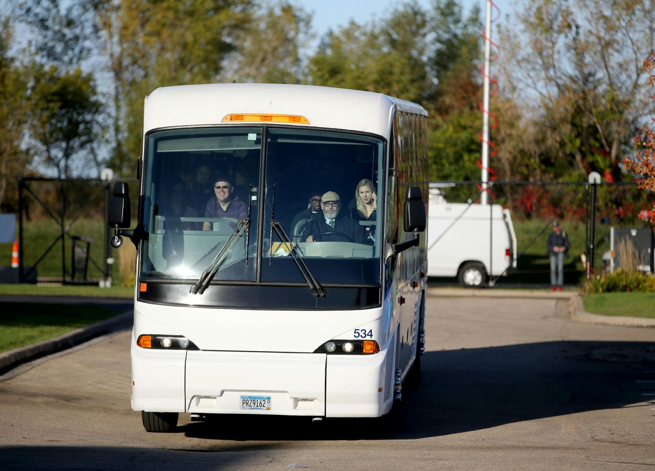 A bus carrying the first fans to get inside the new Paisley Park Tour arrive Thursday, Oct. 6, 2016, in Chanhassen, MN.