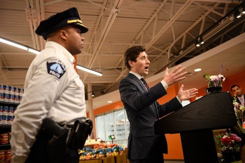 Minneapolis Police Chief Medaria Arradondo stood beside Minneapolis Mayor Jacob Frey as Frey addressed the media Thursday about police-community relations at North Market.