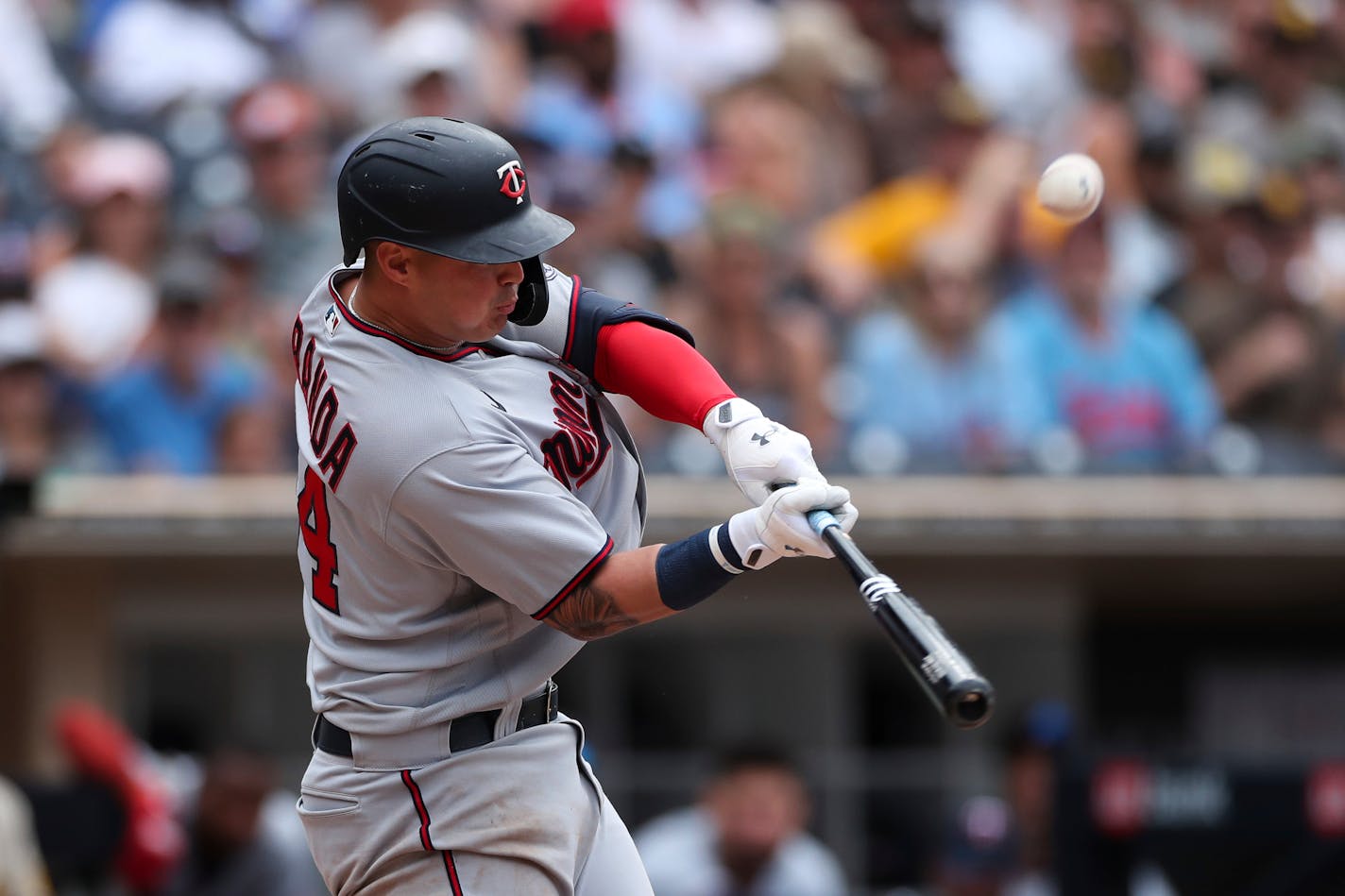 Minnesota Twins' Jose Miranda hits the ball during an at bat against the San Diego Padres in a baseball game Sunday, July 31, 2022, in San Diego. (AP Photo/Derrick Tuskan)