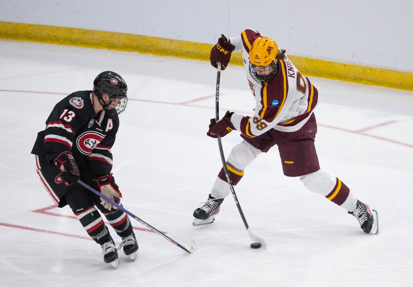 Minnesota Gophers forward Matthew Knies (89) shot in front of St. Cloud State Huskies forward Jami Krannila (13) in the second period. The University of Minnesota Gophers faced the St. Cloud State Huskies in an NCAA Division I Men's Ice Hockey Championship second round game Saturday night, March 25, 2023 at Scheels Arena in Fargo, North Dakota. ] JEFF WHEELER • jeff.wheeler@startribune.com