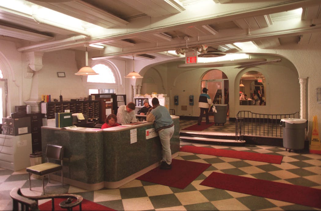 The lobby of the Drake Hotel in 1996. The plastic trash pail at right was catching water dripping from the ceiling, run-off from a damaged roof.