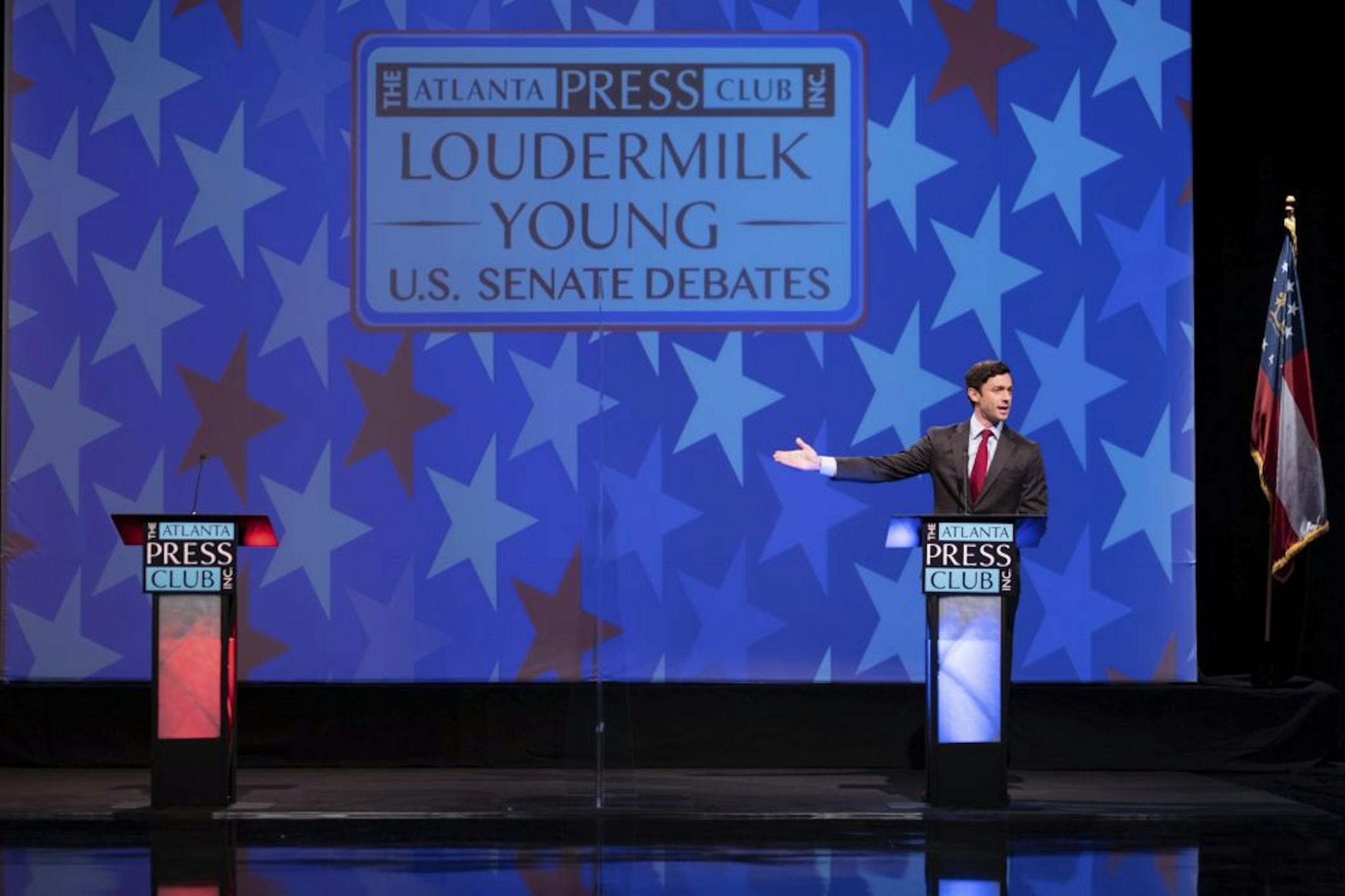 Democratic challenger Jon Ossoff speaks during a debate for U.S. Senate on Sunday, Dec. 6, 2020, in Atlanta. Sen. David Perdue declined to attend the debate.
