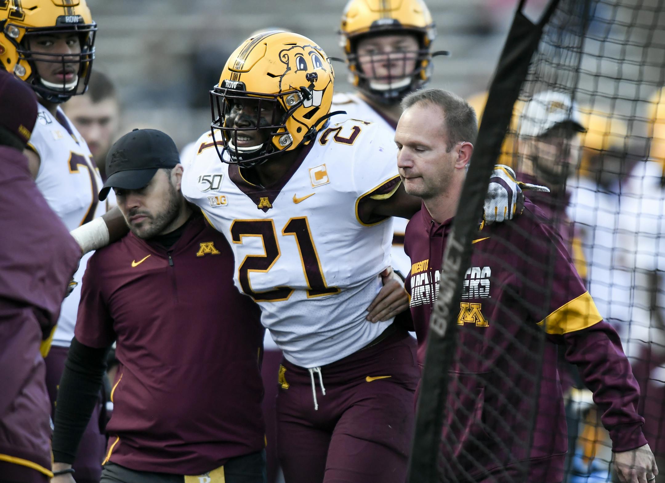 Gophers linebacker Kamal Martin (21) was helped off the field with a leg injury in the third quarter. ] Aaron Lavinsky • aaron.lavinsky@startribune.com The Gophers played Rutgers on Saturday, Oct. 19, 2019 at SHI Stadium in Piscataway, N.J..