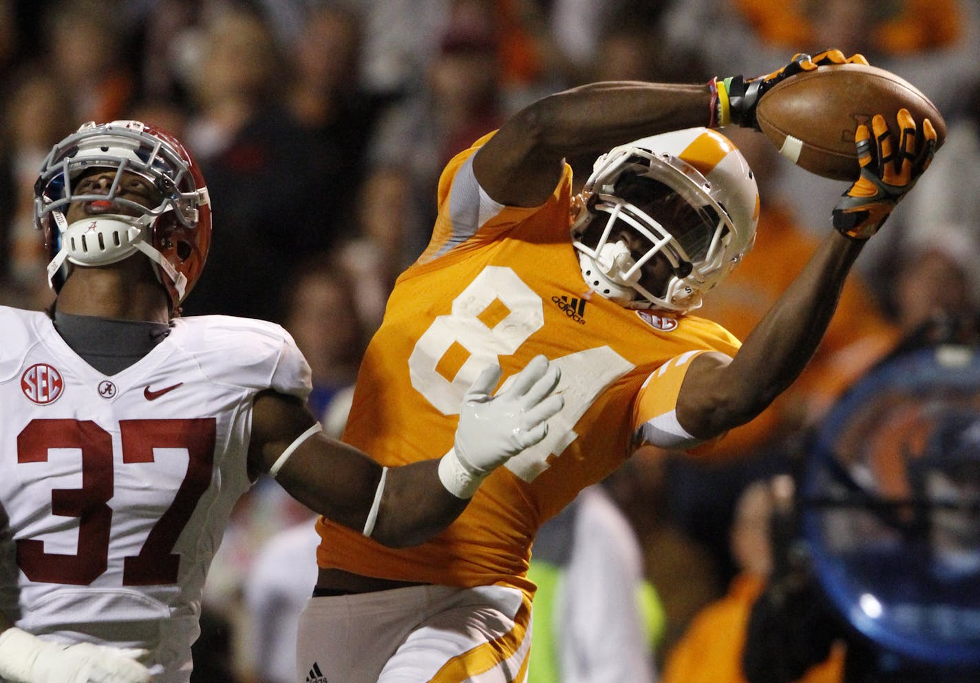 Tennessee wide receiver Cordarrelle Patterson (84) catches a pass over Alabama defensive back Robert Lester (37) during the first quarter of an NCAA college football game on Saturday, Oct. 20, 2012, in Knoxville, Tenn. (AP Photo/Wade Payne) ORG XMIT: TNWP103