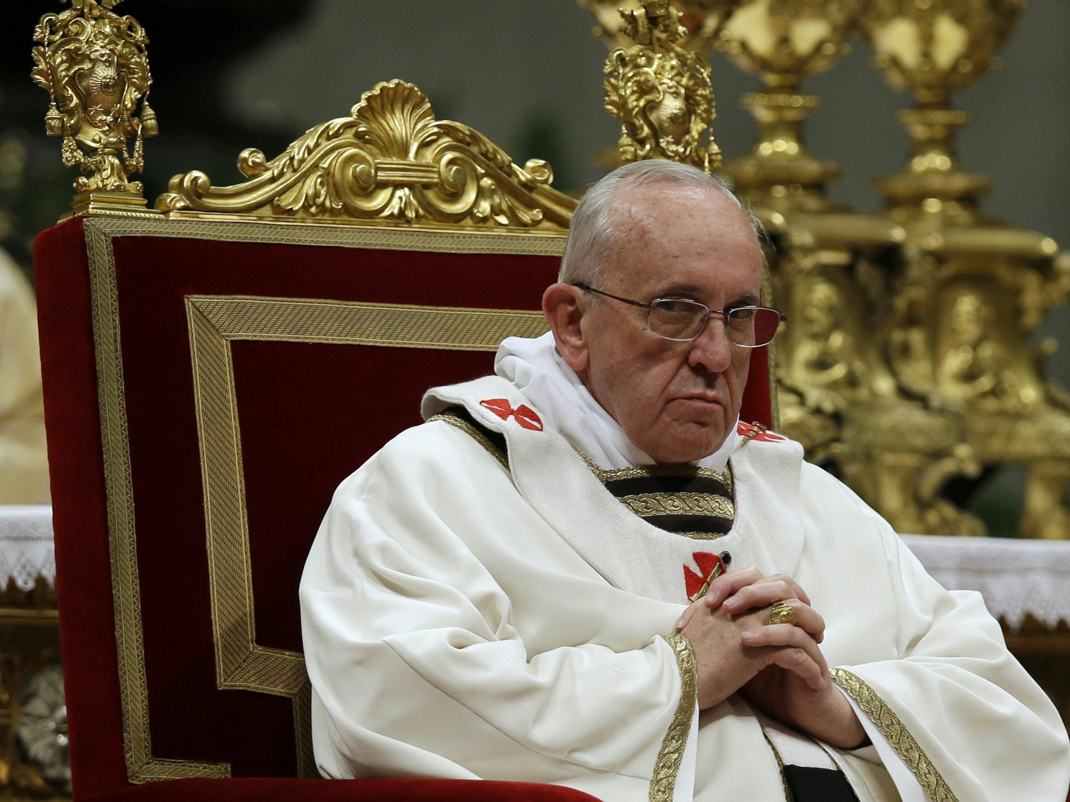 Pope Francis celebrates the Christmas Eve Mass in St. Peter's Basilica at the Vatican, Tuesday, Dec. 24, 2013. (AP Photo/Gregorio Borgia) ORG XMIT: MIN2013122616234579