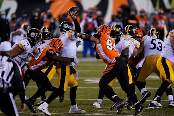 Pittsburgh Steelers quarterback Ben Roethlisberger (7) is hit as he throws during the second half of an NFL football game against the Cincinnati Benga