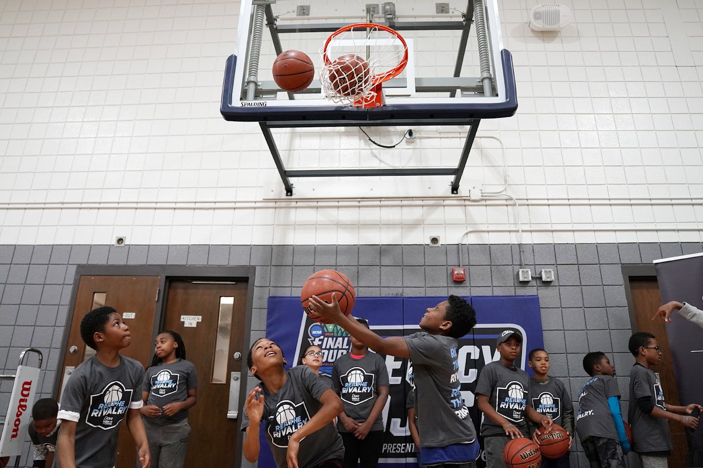 A group of students got to take the first shots at the finished Final Four "Legacy Project" basketball court at the North Commons Recreation Center.