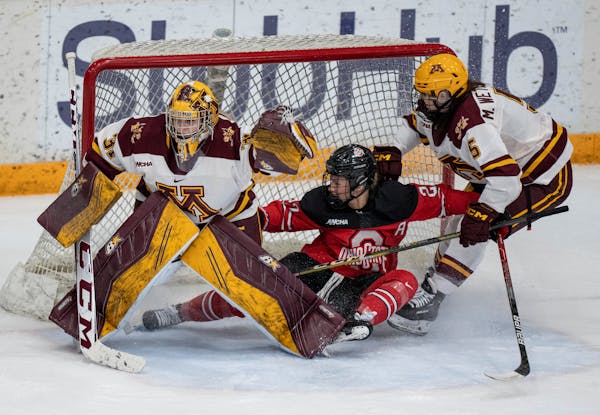 Gophers goalie Skylar Vetter has a 1.82 goals-against average, and Madeline Wethington, right, is a key member of the team’s defensive corps.