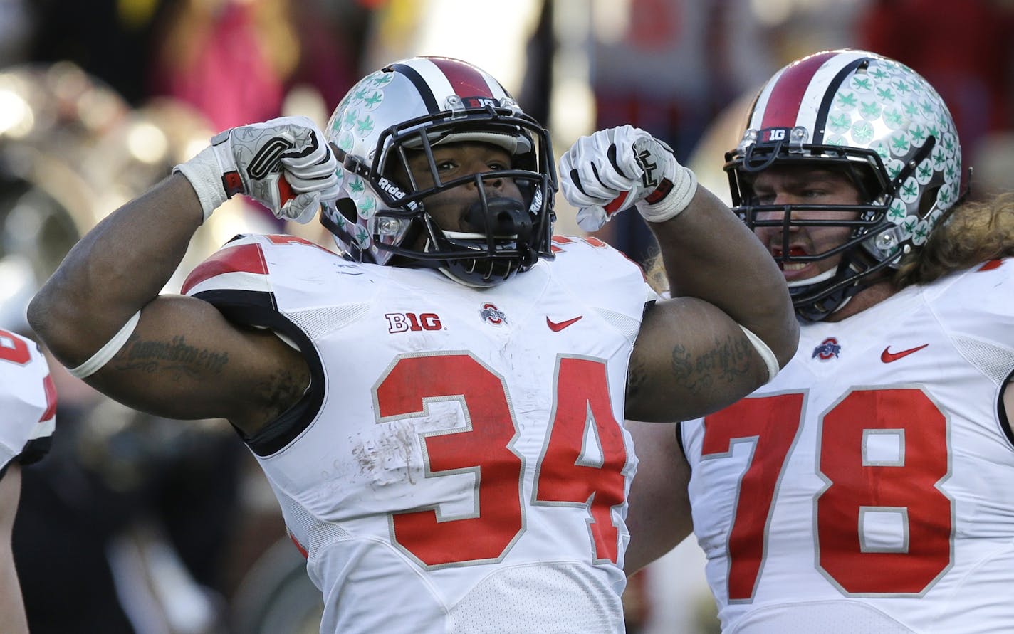 Ohio State running back Carlos Hyde (34) reacts after his touchdown during the second half of an NCAA college football game against Michigan in Ann Arbor, Mich., Saturday, Nov. 30, 2013. Ohio State defeated Michigan 42-41. (AP Photo/Carlos Osorio)