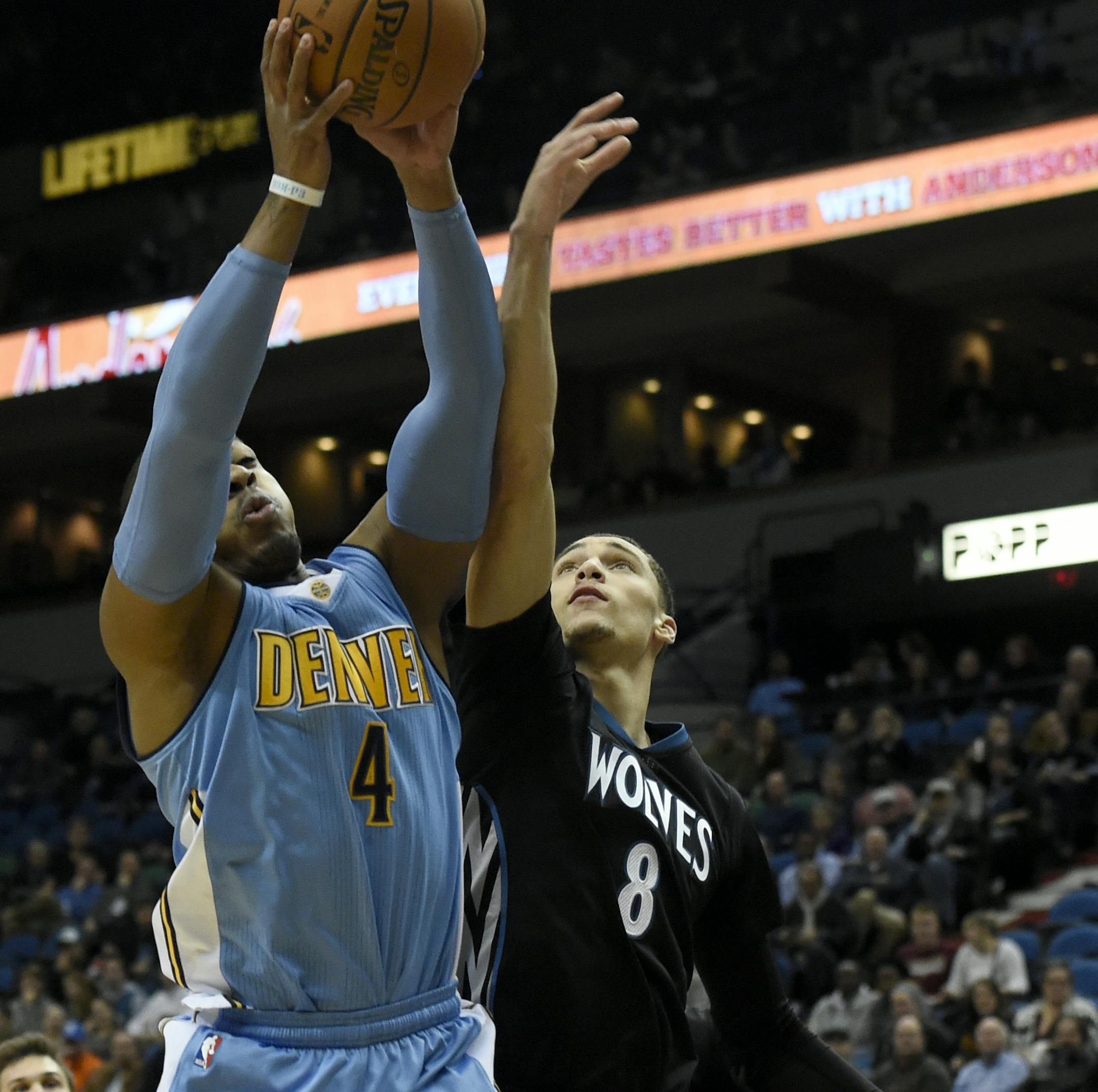 Denver Nuggets guard Randy Foye (4) grabs a rebound against Minnesota Timberwolves guard Zach LaVine (8) during the first quarter of an NBA basketball game Tuesday, Dec. 15, 2015, in Minneapolis. (AP Photo/Hannah Foslien)