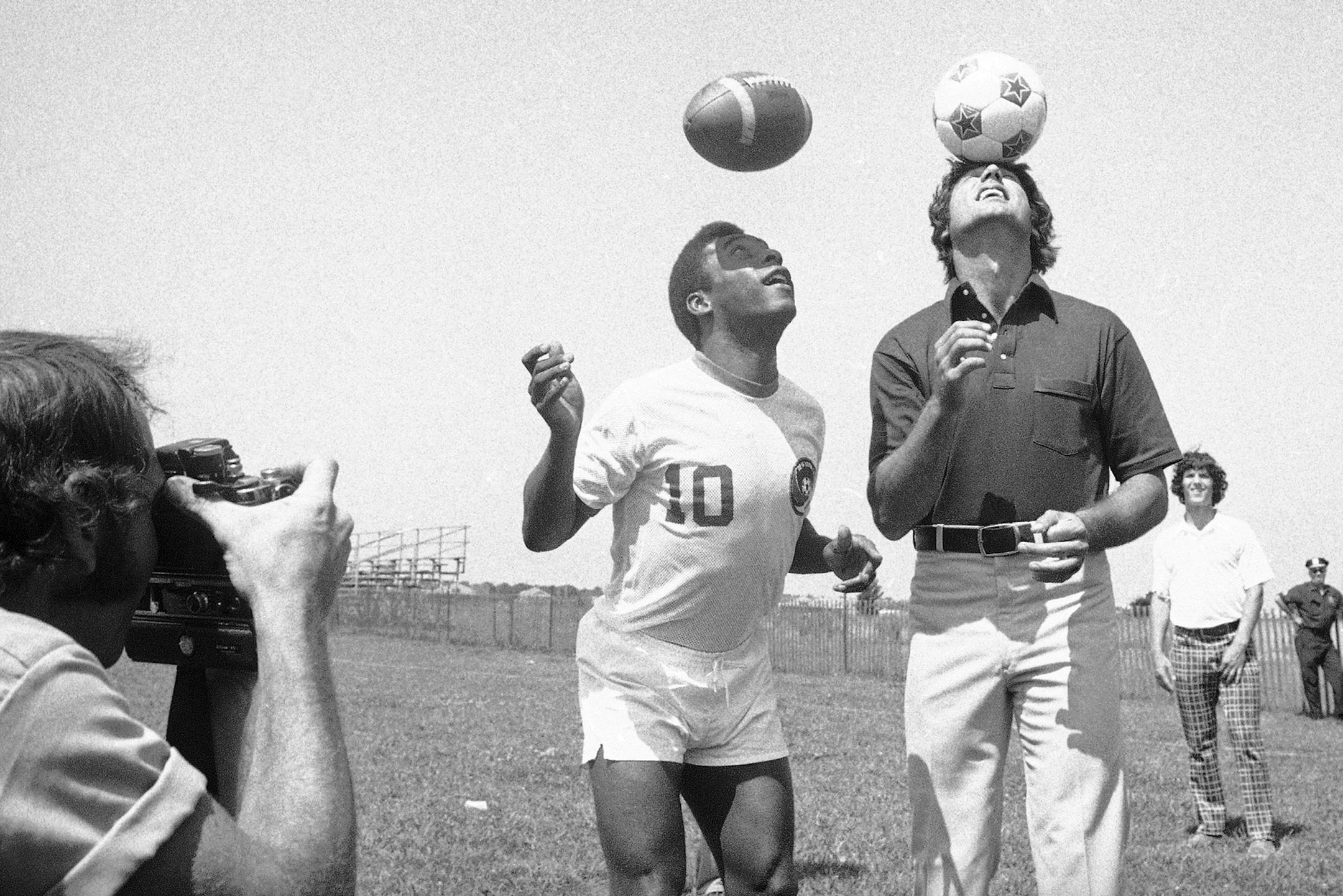 FILE - In this Aug. 5, 1975, file photo, New York Jets quarterback Joe Namath, right, bounces soccer ball on his head while Pele, of the New York Cosmos, uses his head to get a feel for the pigskin at the Jets' training camp at Hofstra University in Hempstead, N.Y. Pele, who has had an interest in the NFL since his Cosmos days in the 1970s, will appear in a commercial during Sunday night's game for Subway as their latest "Famous Fan'' and first global brand ambassador. Pele said, "I still rememb
