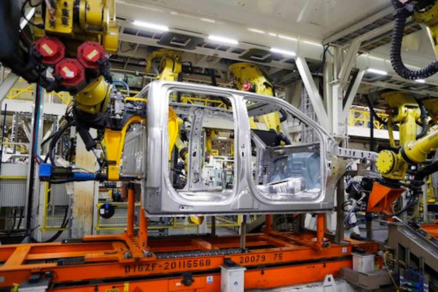 Robots weld the cab of a 2018 Ford F-150 truck on the assembly line at the Ford Rouge assembly plant, Thursday, Sept. 27, 2018, in Dearborn, Mich. (AP Photo/Carlos Osorio)