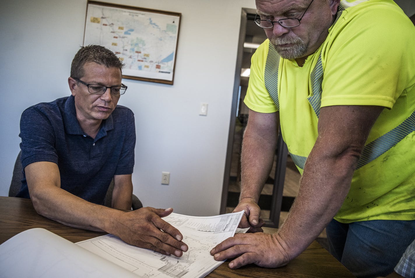 White Earth Reservation member Matt Gordon and his concrete specialist Bob Bjorge look over plans for Line 3 pump houses that could amount to a $25/30 million contract that the Gordon Construction could oversee as a general contractor.] We go out on tribal cultural survey in the woods and lake area around the proposed pipeline route. Also, on Monday afternoon (2 p.m.) we drop in on Gordon Construction in Mahnomen to talk with Matt Gordon for story on Indian-owned businesses doing work on the pip