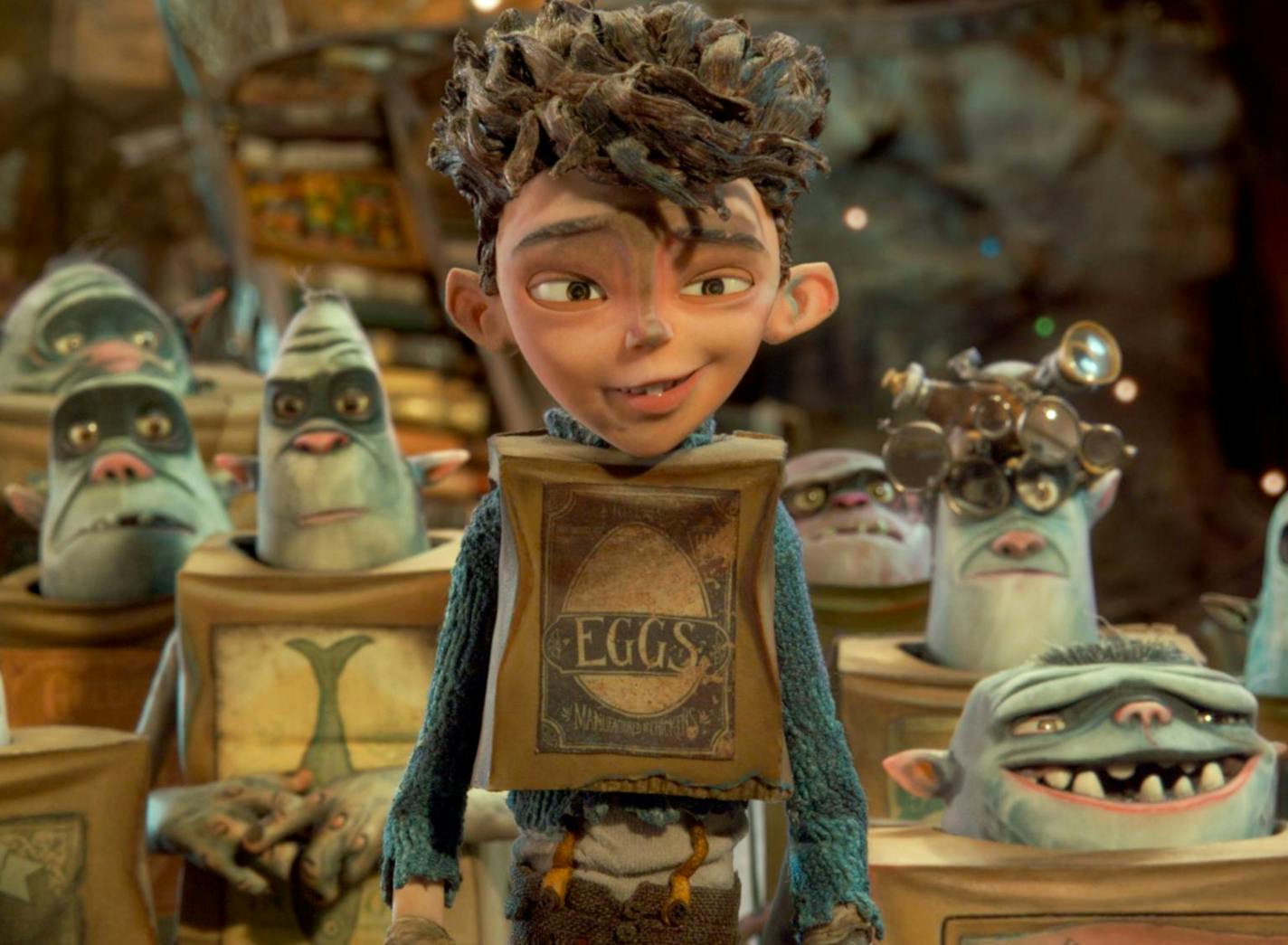 Eggs (center, voiced by Isaac Hempstead Wright) is surrounded by his Boxtroll friends in LAIKA and Focus Features' family event movie THE BOXTROLLS, opening nationwide September 26th. Credit: LAIKA, Inc. / Focus Features