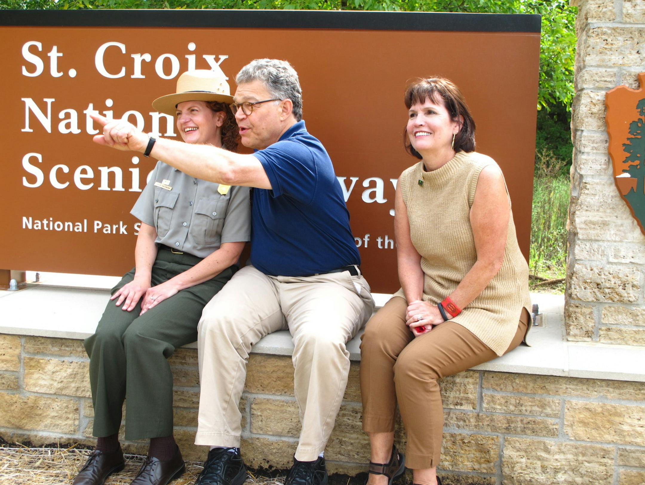 U.S. Sen. Al Franken makes a point to Julie Galonska, interim superintendent of the St. Croix National Scenic Riverway, and U.S. Rep. Betty McCollum. The sign behind them was recently unveiled at a rededication of Stillwater's historic Boom Site.