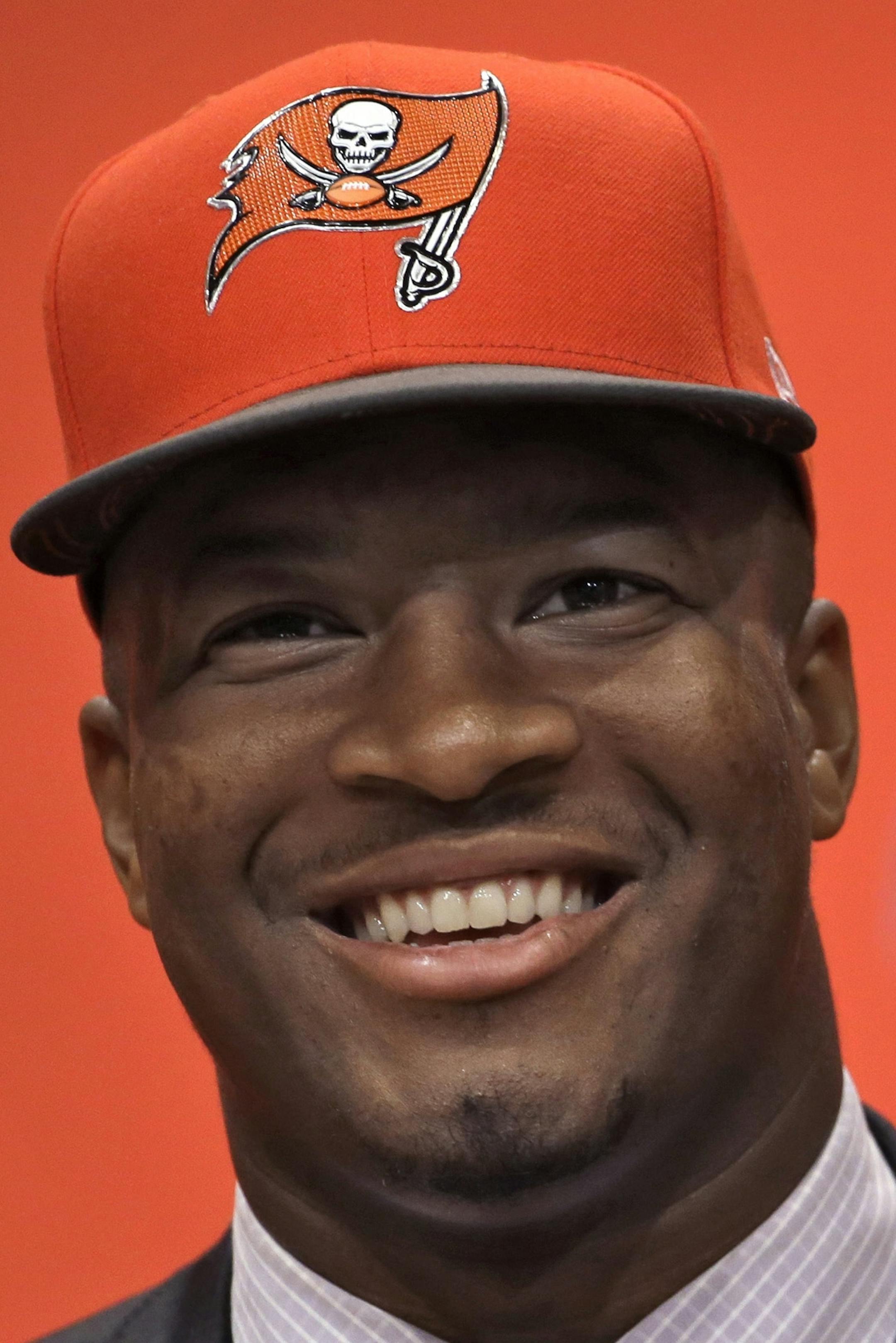 Tampa Bay Buccaneers first-round draft pick Jameis Winston smiles during a news conference Friday, May 1, 2015, in Tampa, Fla. Winston, former Florida State quarterback, was the first overall pick. (AP Photo/Chris O'Meara) ORG XMIT: FLCO101
