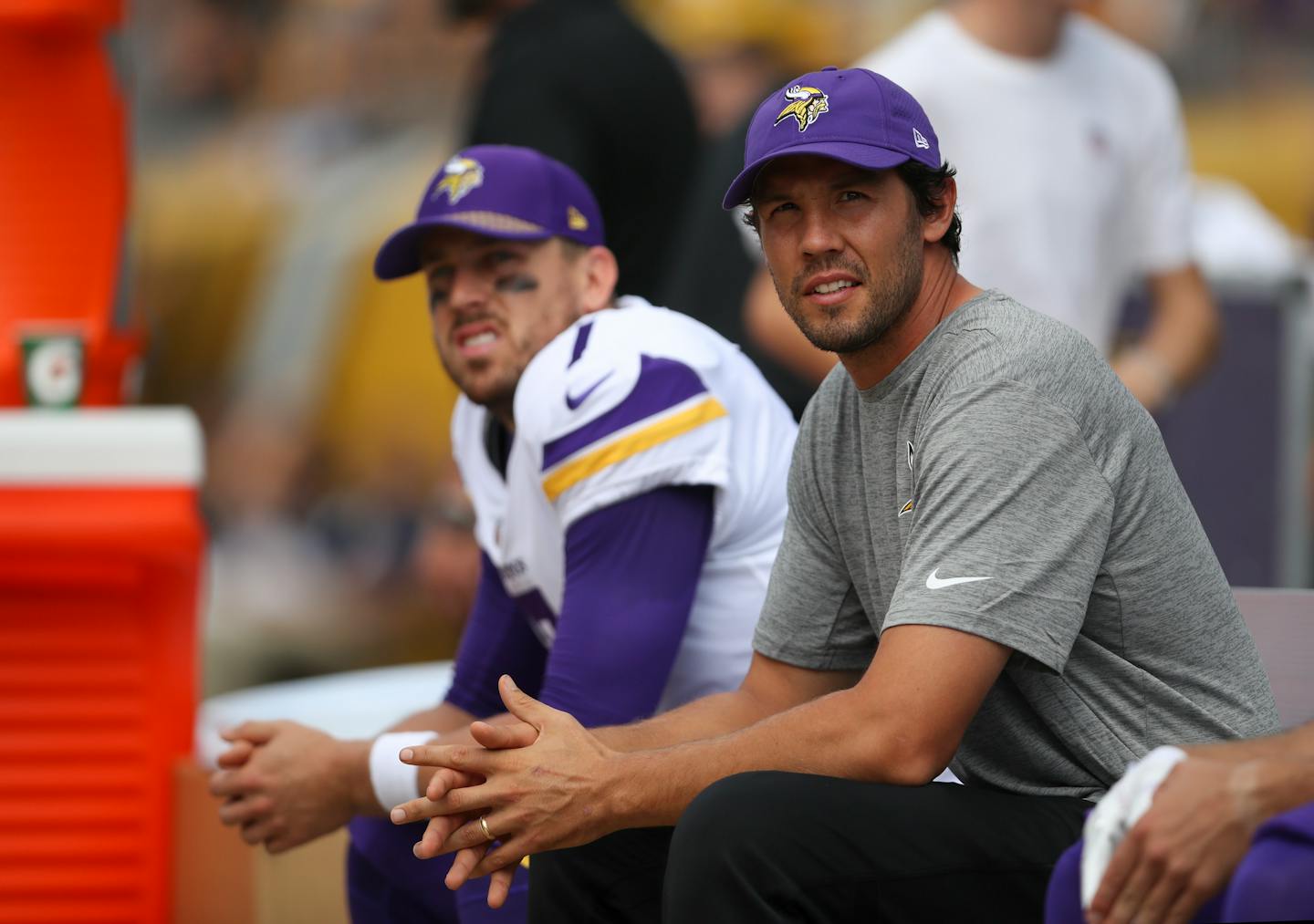 Injured Vikings quarterback Sam Bradford, foreground, sat on the bench with his backup, quarterback Case Keenum