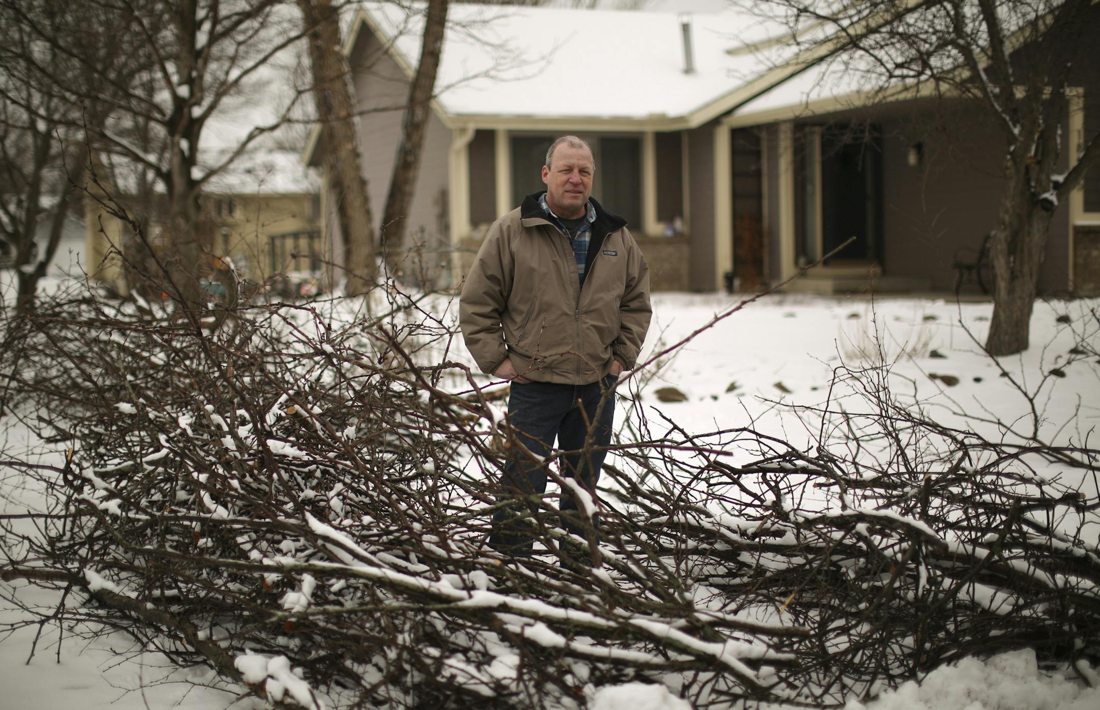Liza Meacham hired Northern Lights Tree and Landscape last year to trim the trees on their property in Lakeville after a representative knocked on their door. The company did the work, but four months later piles of branches are still in the front yard waiting to be hauled away. Kris Meacham Wednesday afternoon, April 10, 2013, stood amid the trimmings left behind by Northern Lights Tree and Landscape in his front yard. ] JEFF WHEELER ‚Ä¢ jeff.wheeler@startribune.com
