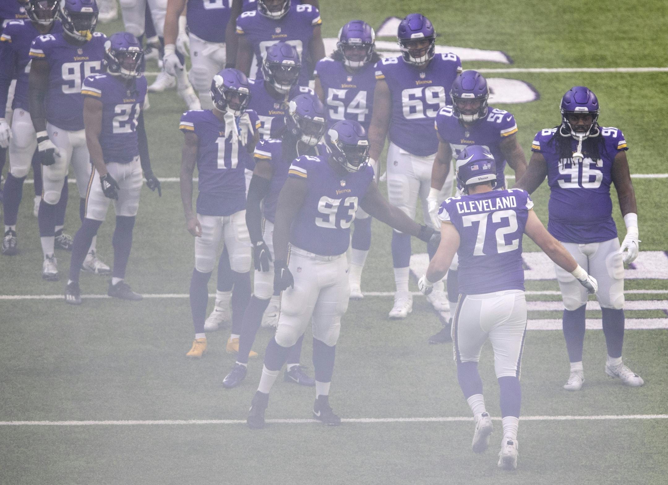 Minnesota Vikings rookie offensive lineman Ezra Cleveland ran on the field during team introductions. Cleveland is starting in his first NFL game.