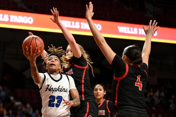 Hopkins, with guard Liv McGill (23), stands No. 1 in the girls basketball Metro Top 10.