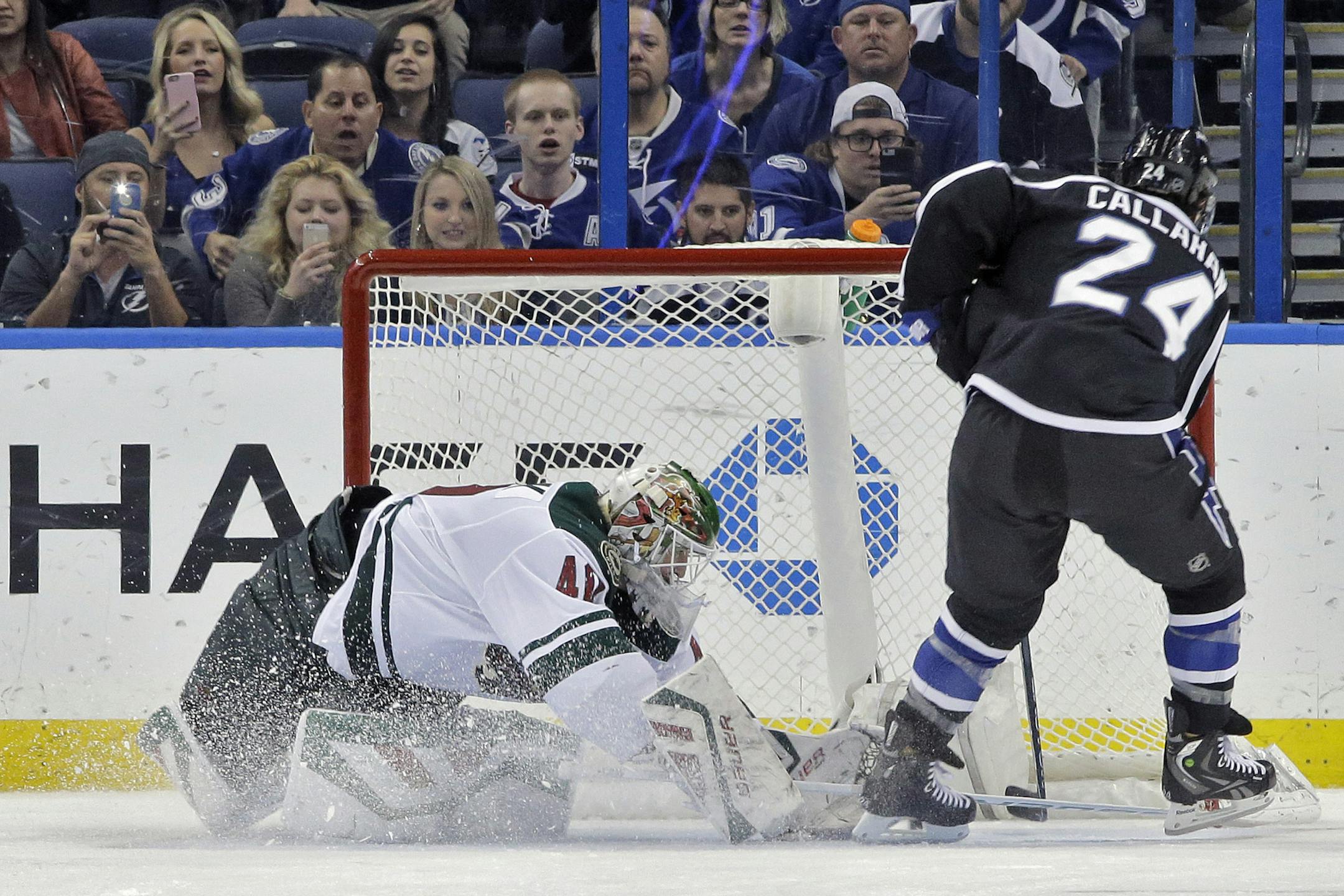 Tampa Bay Lightning right wing Ryan Callahan (24) scores past Minnesota Wild goalie Devan Dubnyk (40) during the shootout in an NHL hockey game Saturday, Jan. 2, 2016, in Tampa, Fla. The Lightning won 3-2. (AP Photo/Chris O'Meara)