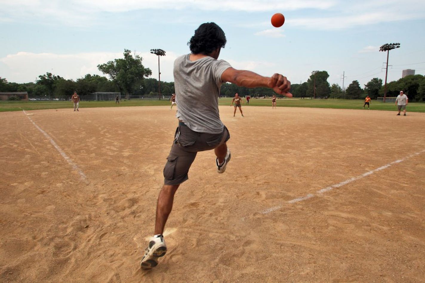 Kickball, once the sport of grade-school recess, is back in fashion among young adults. The Minneapolis Park Board sponsors 19 kickball leagues of various talent and intensity levels, including the CoEd Sunday Recreational league. We photographed a recent kickball pickup game at Bryn Mawr field in Minneapolis. Miadad Rashid kicked the ball to the outfield for a hit. (MARLIN LEVISON/STARTRIBUNE(mlevison@startribune.com