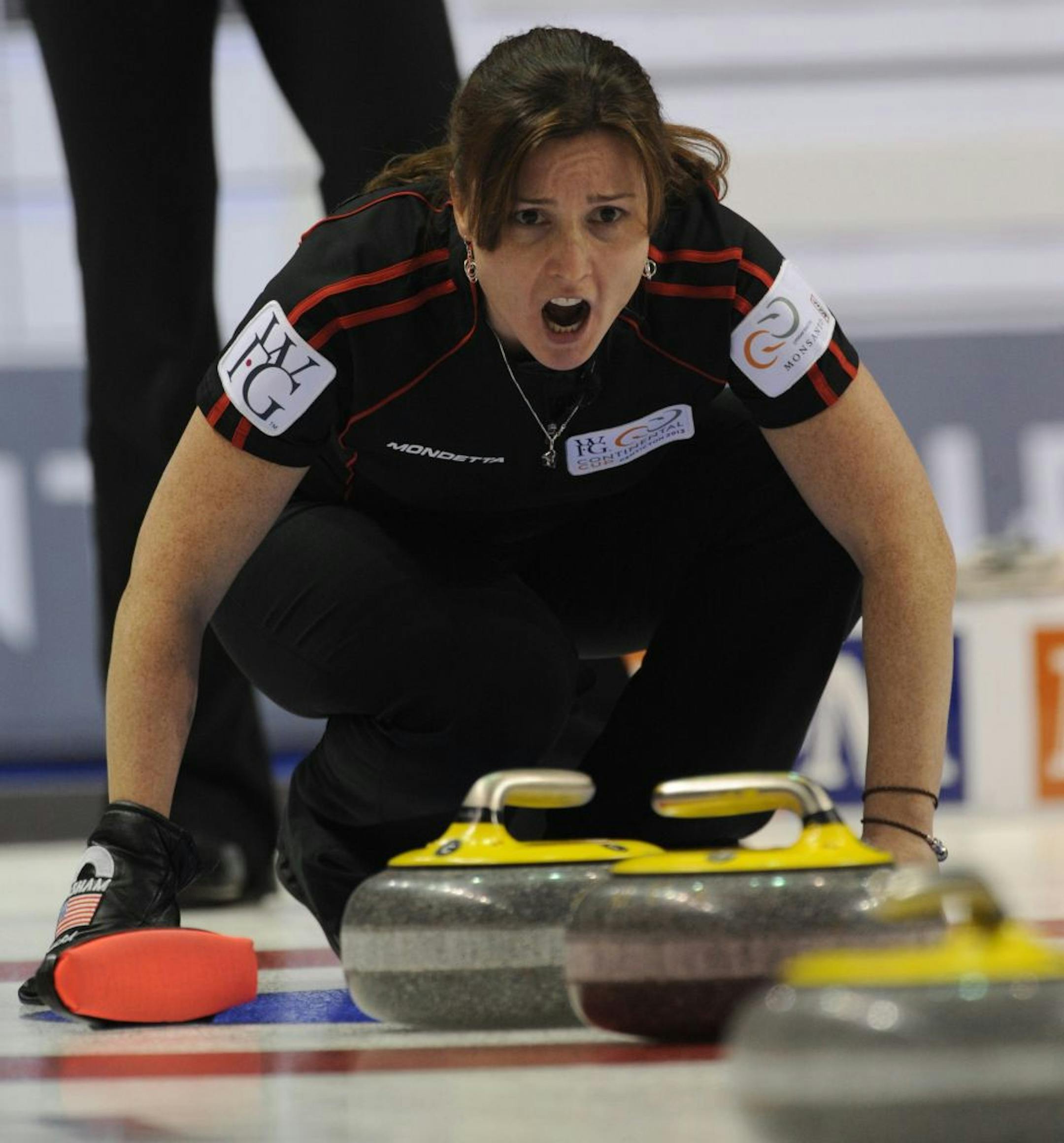 In this image provided by the Canadian Curling Association, Team North America skip Allison Pottinger shouts to her front end during her match against Team World's Eve Muirhead, of Scotland, at the World Financial Group Continental Cup curling event in Penticton, British Columbia, Friday, Jan. 11, 2013.