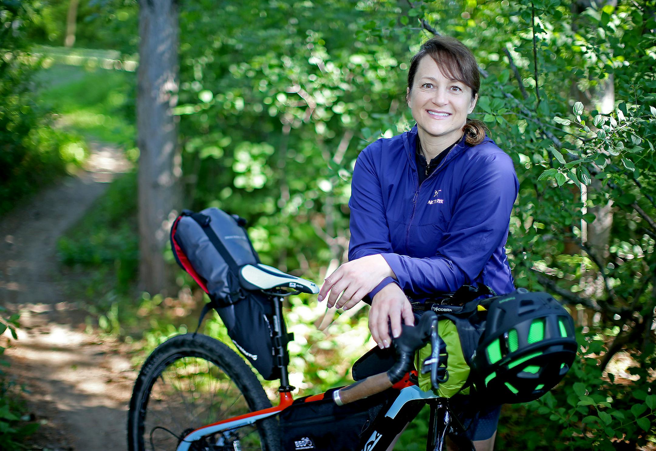 Bonnie Siegel, a mountain biker who is doing the Tour Divide, a grueling race from Canada to Mexico, was all smiles Monday, June 6, 2016 in Eagan, MN. Siegel is coming off near-death medical condition. ] (ELIZABETH FLORES/STAR TRIBUNE) ELIZABETH FLORES • eflores@startribune.com