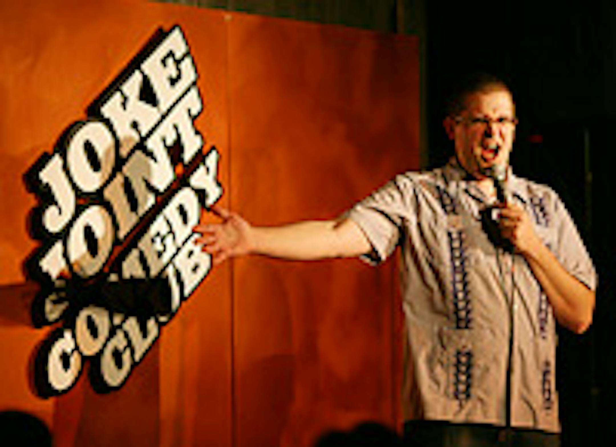 Local comic Wayne Burfeind mugged for the audience Friday during his set at the Joke Joint.