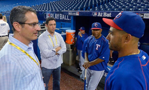 Texas Rangers assistant general manager Thad Levine, left.