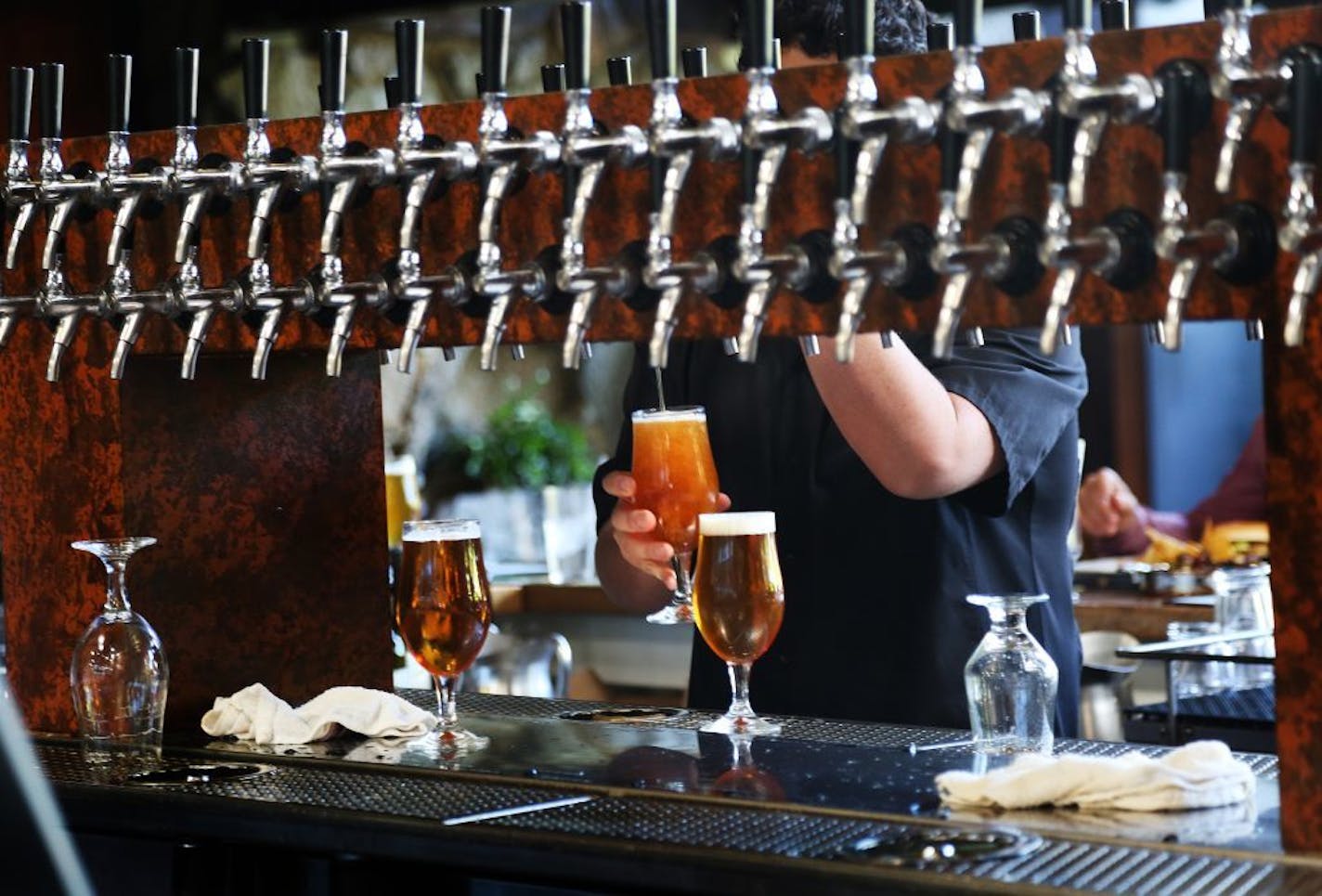 Beer is drawn from many taps inside the restaurant at Stone Brewery on Oct. 12, 2016 in Escondido, Calif.