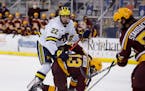 Owen Power (22) played against the Gophers last season, and could be the top pick in Friday’s first round of the NHL draft.