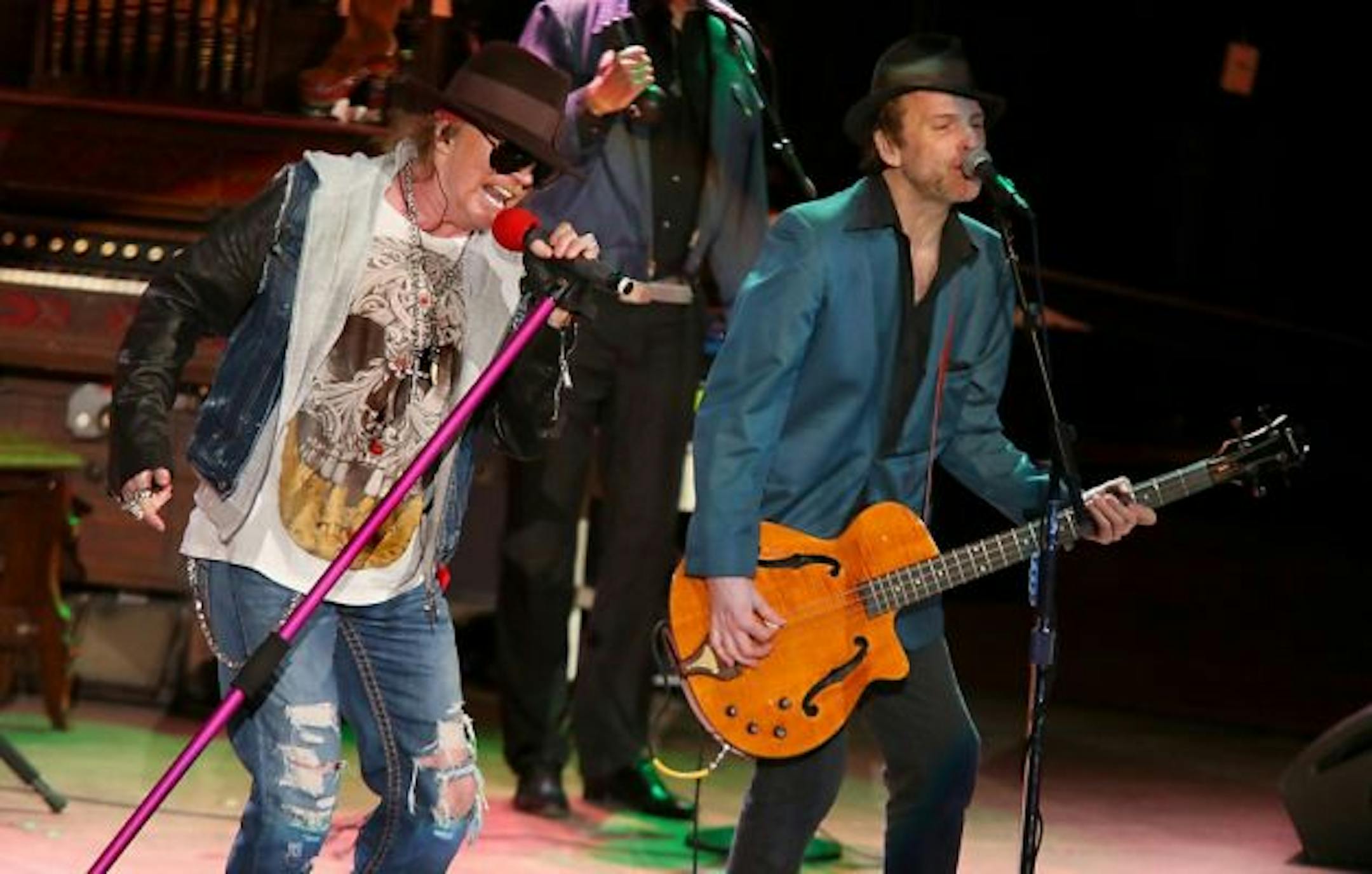 Tommy Stinson, right, with Axl Rose in San Francisco in 2012. / Barry Brecheisen, Associated Press