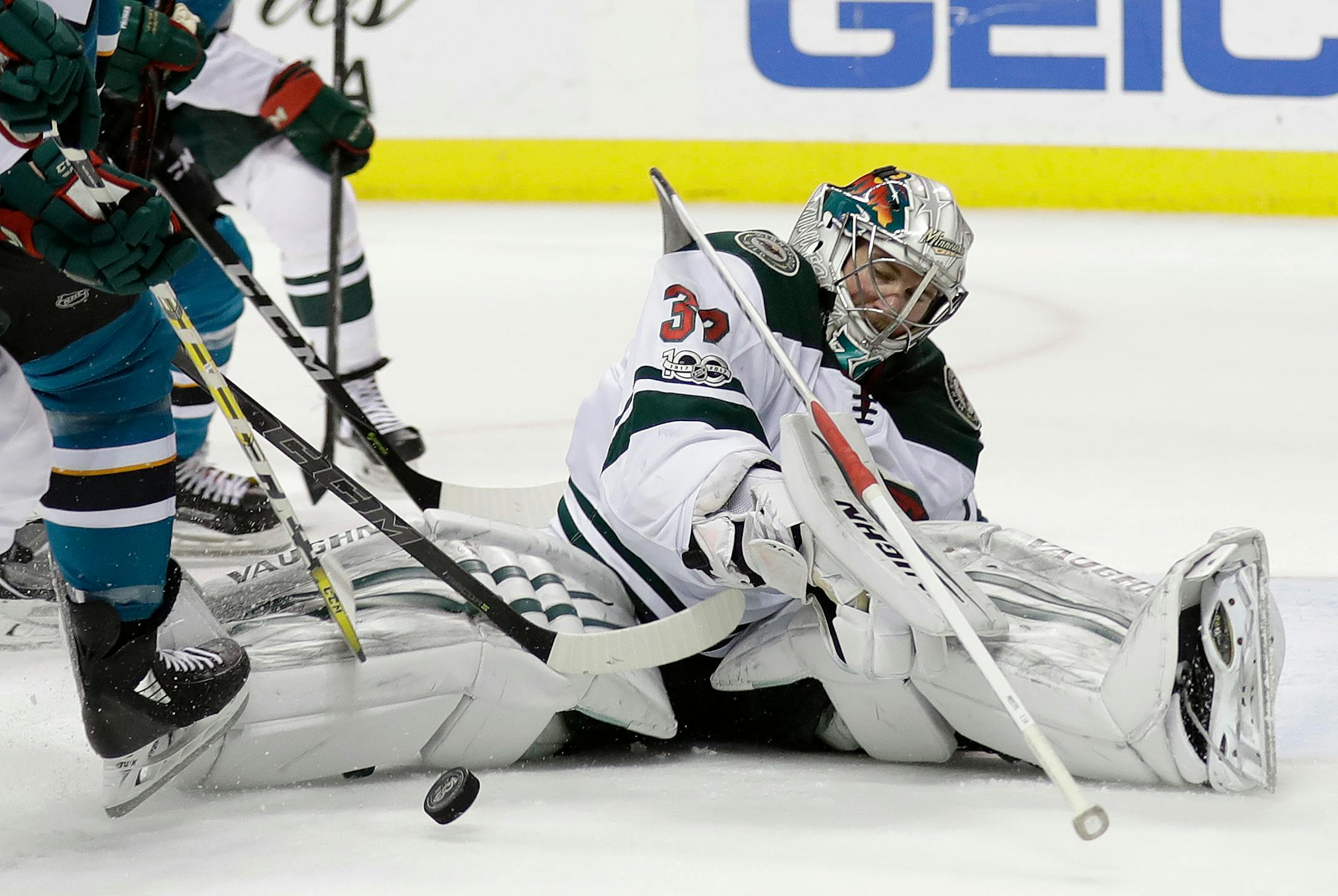 Minnesota Wild goalie Alex Stalock stops a shot against the San Jose Sharks during the second period of an NHL hockey game Sunday, Dec. 10, 2017, in San Jose, Calif. (AP Photo/Marcio Jose Sanchez)