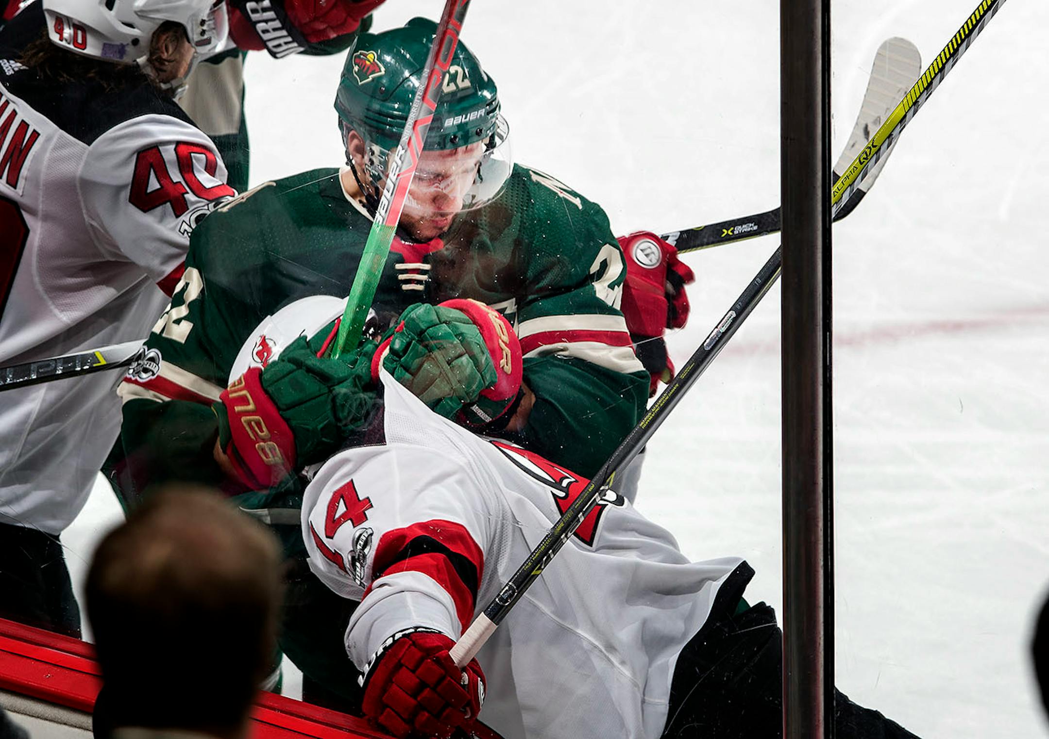 Nino Niederreiter (22) got tangled up with Adam Henrique (14) in the third period. Niederreiter was called for a penalty on the play.