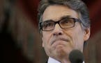 FILE - In this Jan. 15, 2015 file photo, Gov. Rick Perry addresses a joint session of the Texas Legislature, in Austin, Texas. A Texas judge on Tuesda