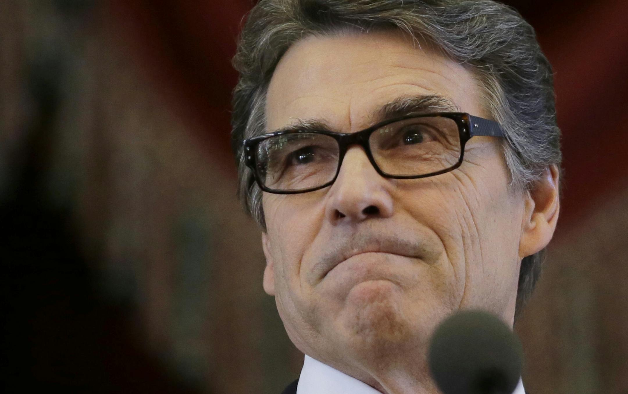 FILE - In this Jan. 15, 2015 file photo, Gov. Rick Perry addresses a joint session of the Texas Legislature, in Austin, Texas. A Texas judge on Tuesday, Jan. 27, 2015, refused to throw out a felony abuse-of-power case against former Gov. Perry on constitutional grounds, ruling that the case against the possible 2016 presidential hopeful should continue. (AP Photo/Eric Gay, File)