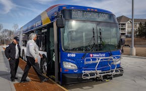 Metro Transit trainer Yolanda Sims trains Xang Xiong on the new Gold Line BRT bus as he makes his way down the route from St. Paul to Woodbury.