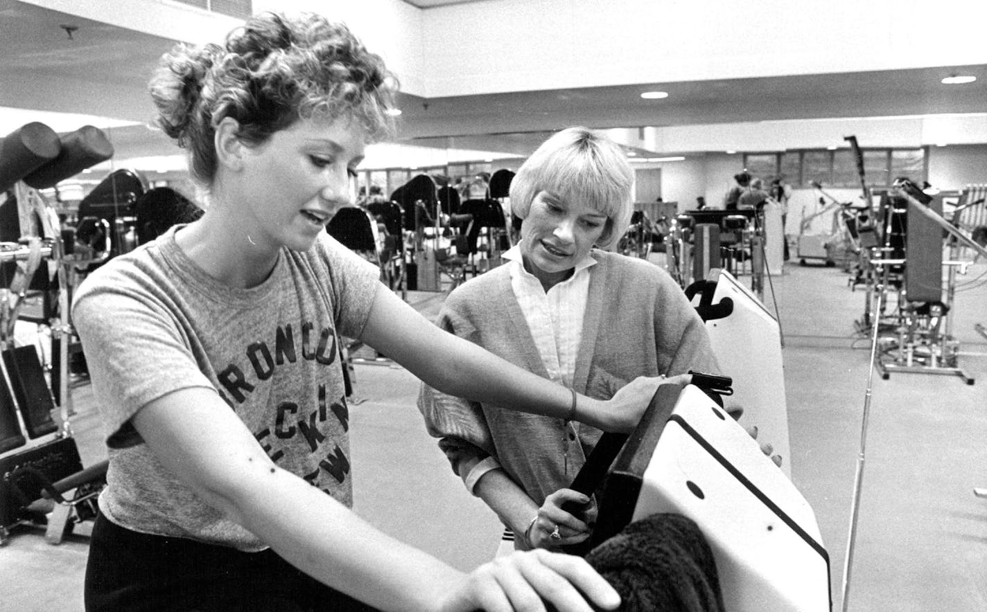 May 14, 1985 The Marsh (Health Club) Ruth Stricker checks Johnna Wenburg as she rides exercycle Duane Braley, Minneapolis Star Tribune